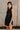 Daniela Navy Satin High Neckline Mini Dress- frontal side view