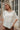 Coraline Cream Asymmetric Top - close front view