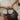 model holding the Lennon Brown Leather Purse - flat lay