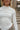 Rae Ivory Mock Neck Top- close up