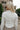 Rae Ivory Mock Neck Top- close up back view