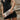 model holding the Shiloh Snake Skin Clutch - Front view