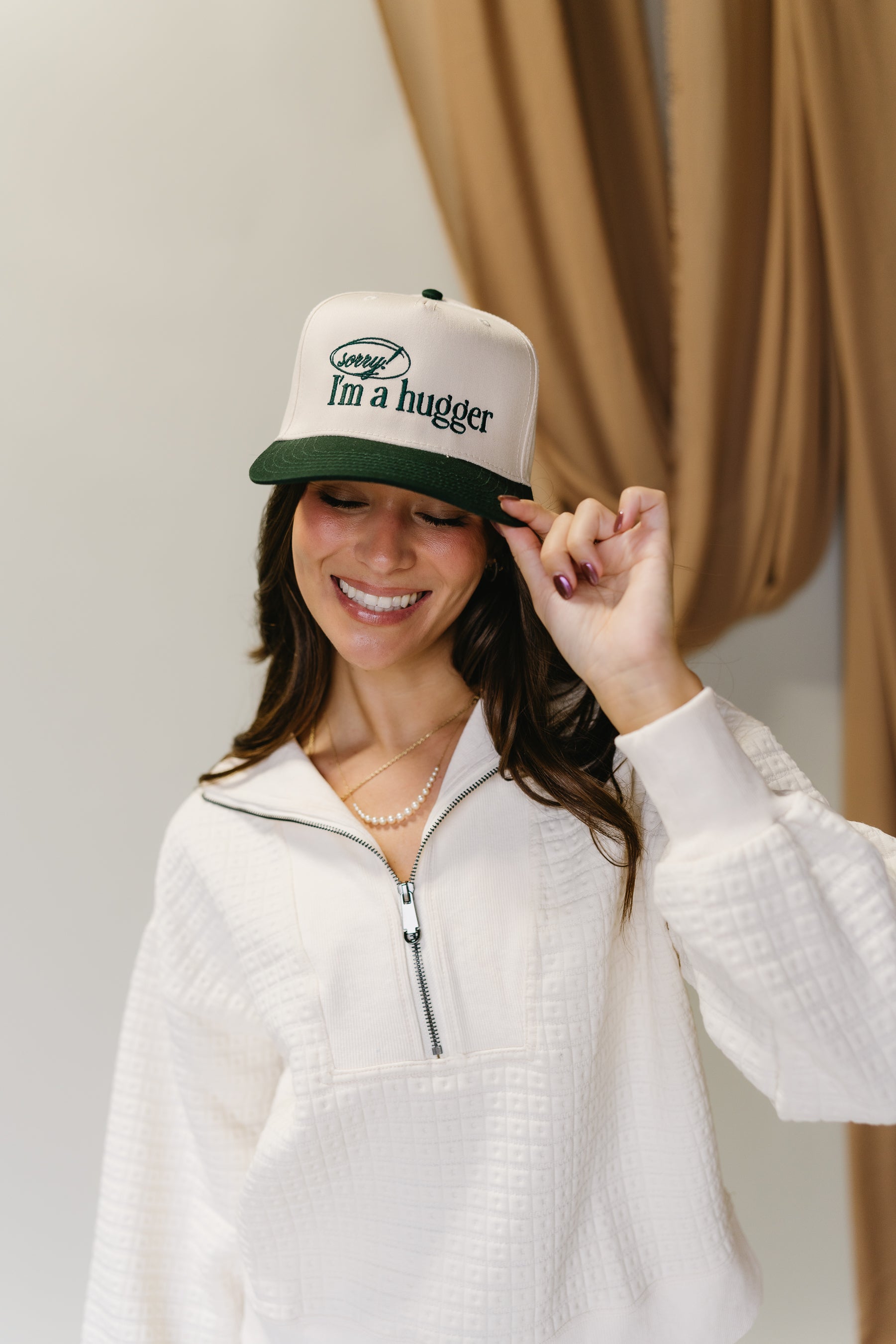 Sorry I'm A Hugger Green Trucker Hat - front view on model