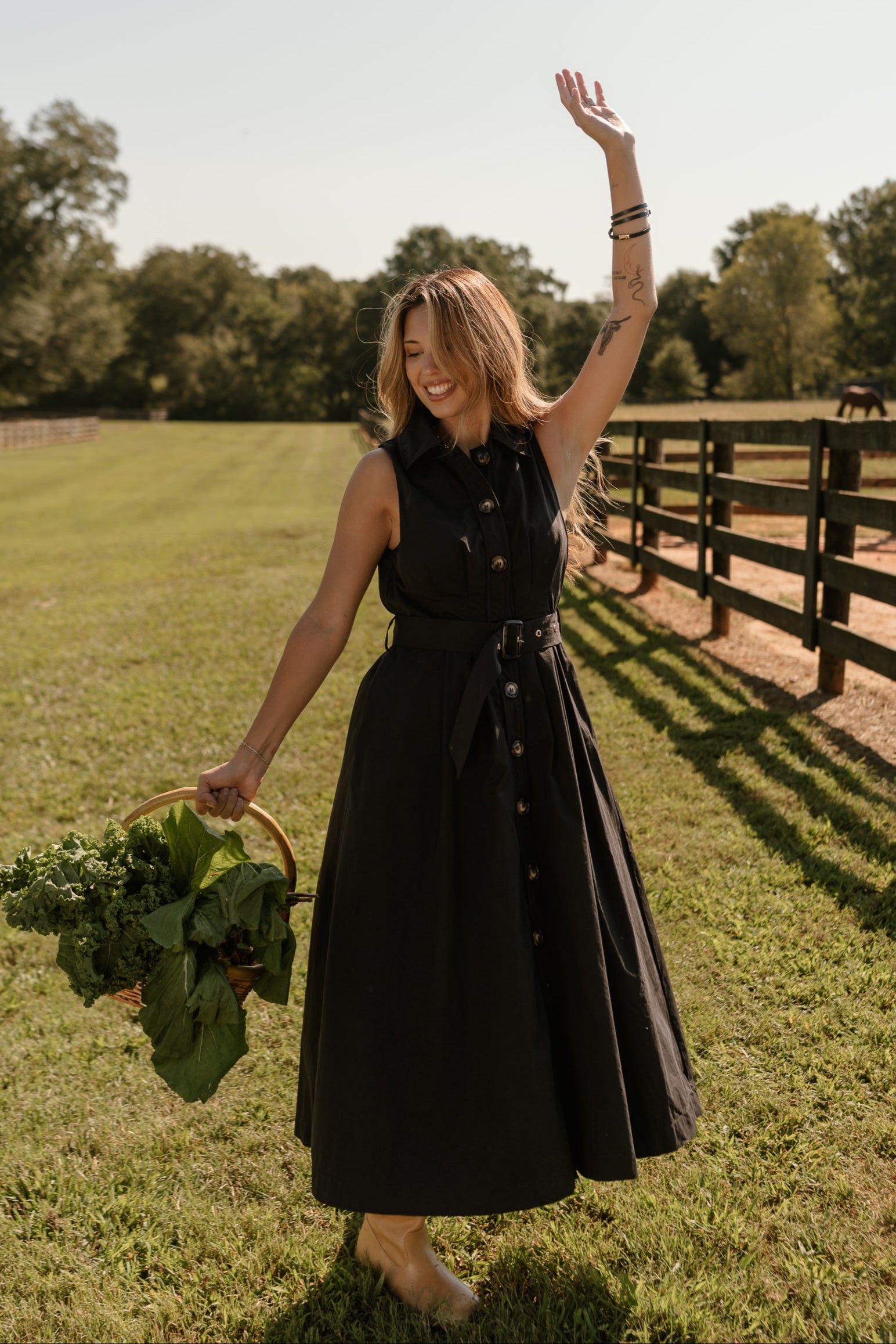 full body front view of the Augusta Black Buckle Midi Dress