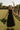 full body front view of the Augusta Black Buckle Midi Dress