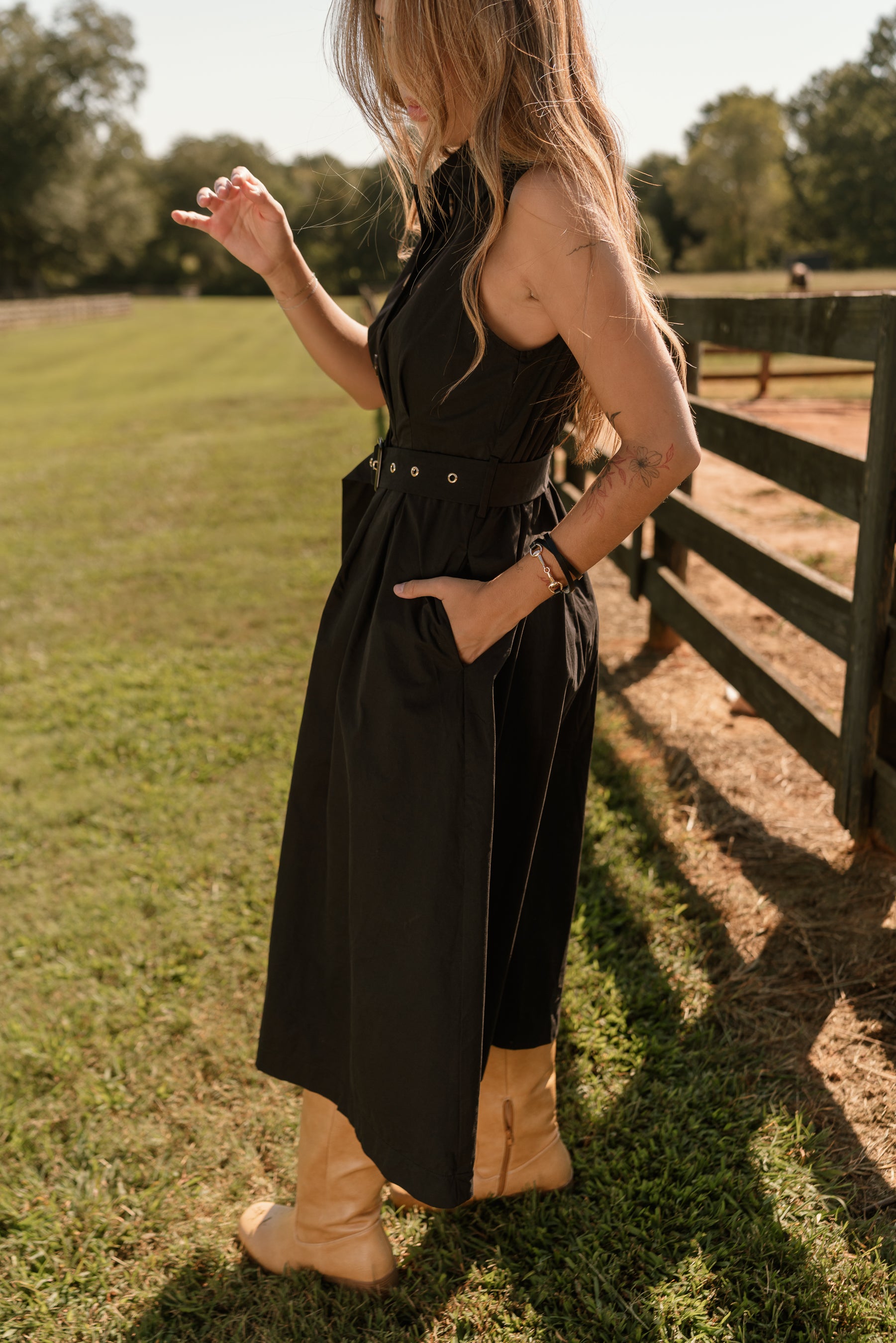 side view of the Augusta Black Buckle Midi Dress