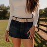 Corinne Dark Denim Mini Skort - close up front view (with belt)