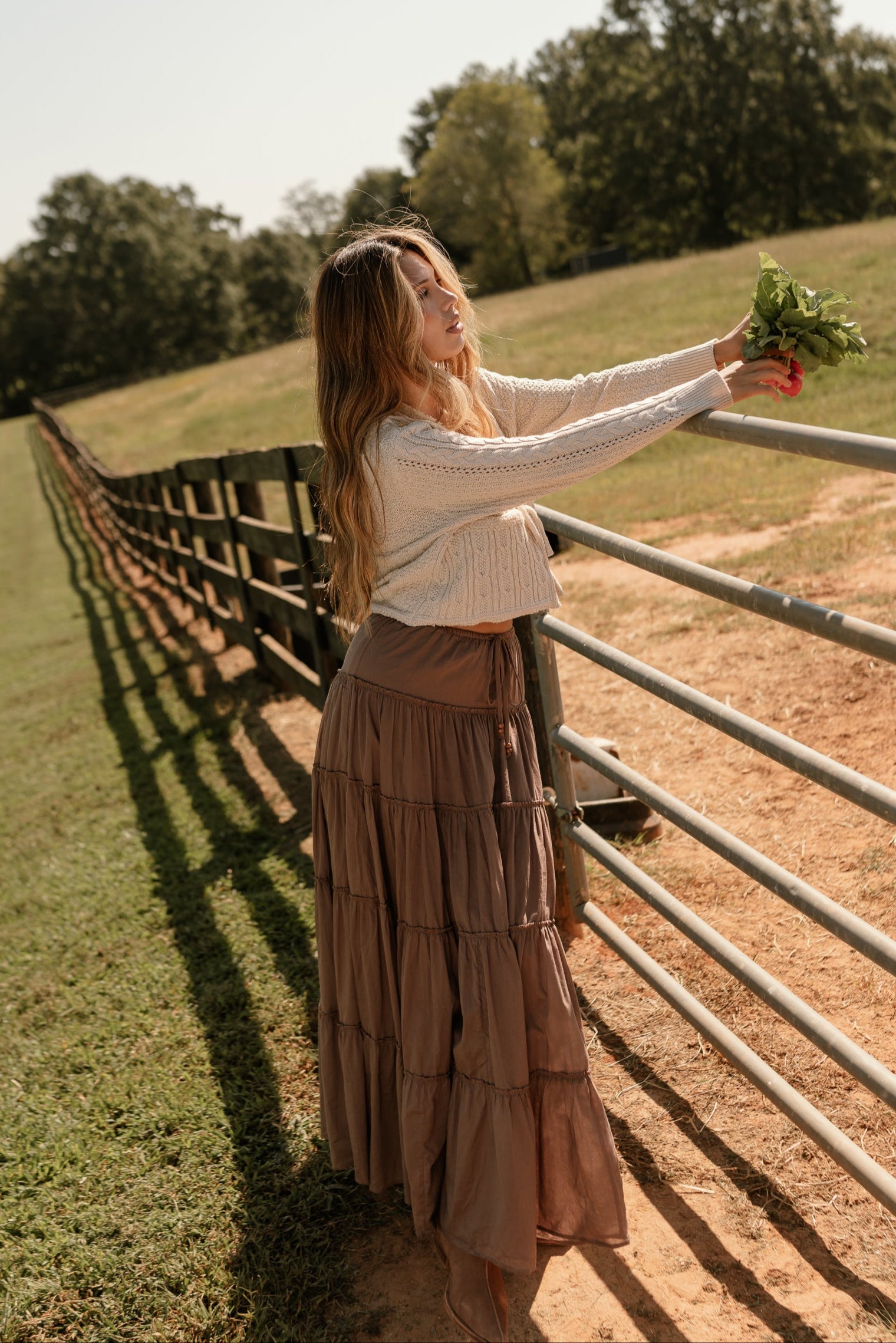 full body front view of the Vittoria Brown Tiered Maxi Skirt
