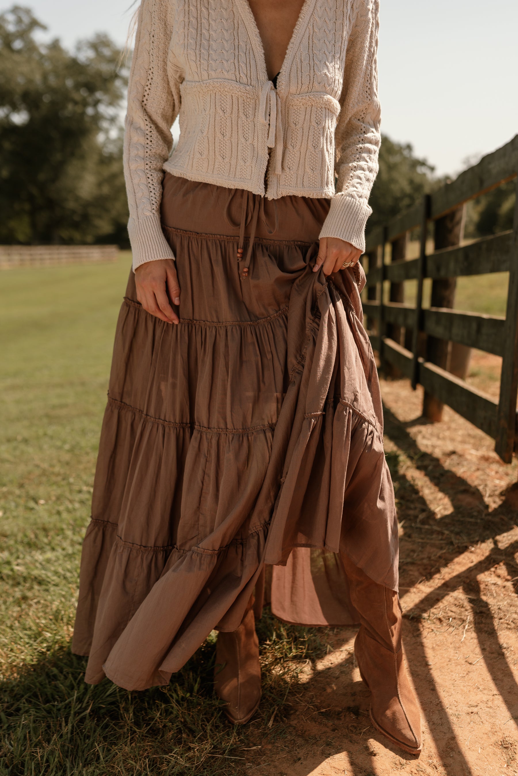  front view of the Vittoria Brown Tiered Maxi Skirt