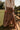  front view of the Vittoria Brown Tiered Maxi Skirt