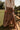  front view of the Vittoria Brown Tiered Maxi Skirt