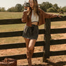 front full body view of the Raleigh Black Denim Mini Skirt