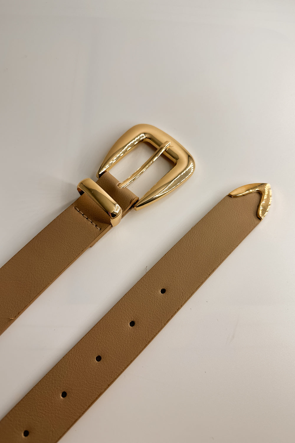 Flat Lay view of the Lucia Taupe Western Adjustable Belt which features aupe Leather Fabric, Gold Adjustable Buckle and Gold Western Detail