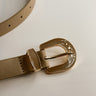 Flat lay view of the Irene Taupe Slim Adjustable Belt which features Taupe Leather Fabric  and Gold Adjustable Buckle