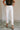 Front view of female model wearing the Ayla White Straight Leg Jeans White Denim Fabric, Straight Leg, Two Front Pockets, Two Back Pockets, Front Zipper with Button Closure and Fray Hem