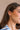 Side view of female model's face; model is wearing the Evelyn Layered Gold Hoop Earring that feature 3 small gold hoops attached together.