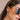 Side view of female model's face; model is wearing the Evelyn Layered Gold Hoop Earring that feature 3 small gold hoops attached together.
