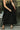 Loren Black Sleeveless Corset Midi Dress- close up bottom front view