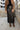 Gemma Black Faux Leather Midi Skirt- close up front view