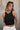 Front view of female model wearing the Julie Ribbed Sleeveless Tank in Black which features Ribbed Lightweight Fabric, Round Neckline and Sleeveless.