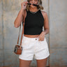 Front view of female model wearing the Katherine Tortoise Buttoned Shorts  in White which features Cotton Fabric, Two Front Pockets, Two Back Pockets, Belt Loops and Front Zipper with Tortoise Button Closure