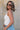 side view of female model wearing the Leigh Square Neckline Sleeveless Tank which features Ribbed Lightweight Fabric, Square Neckline and Sleeveless. the tank is available in white and black.