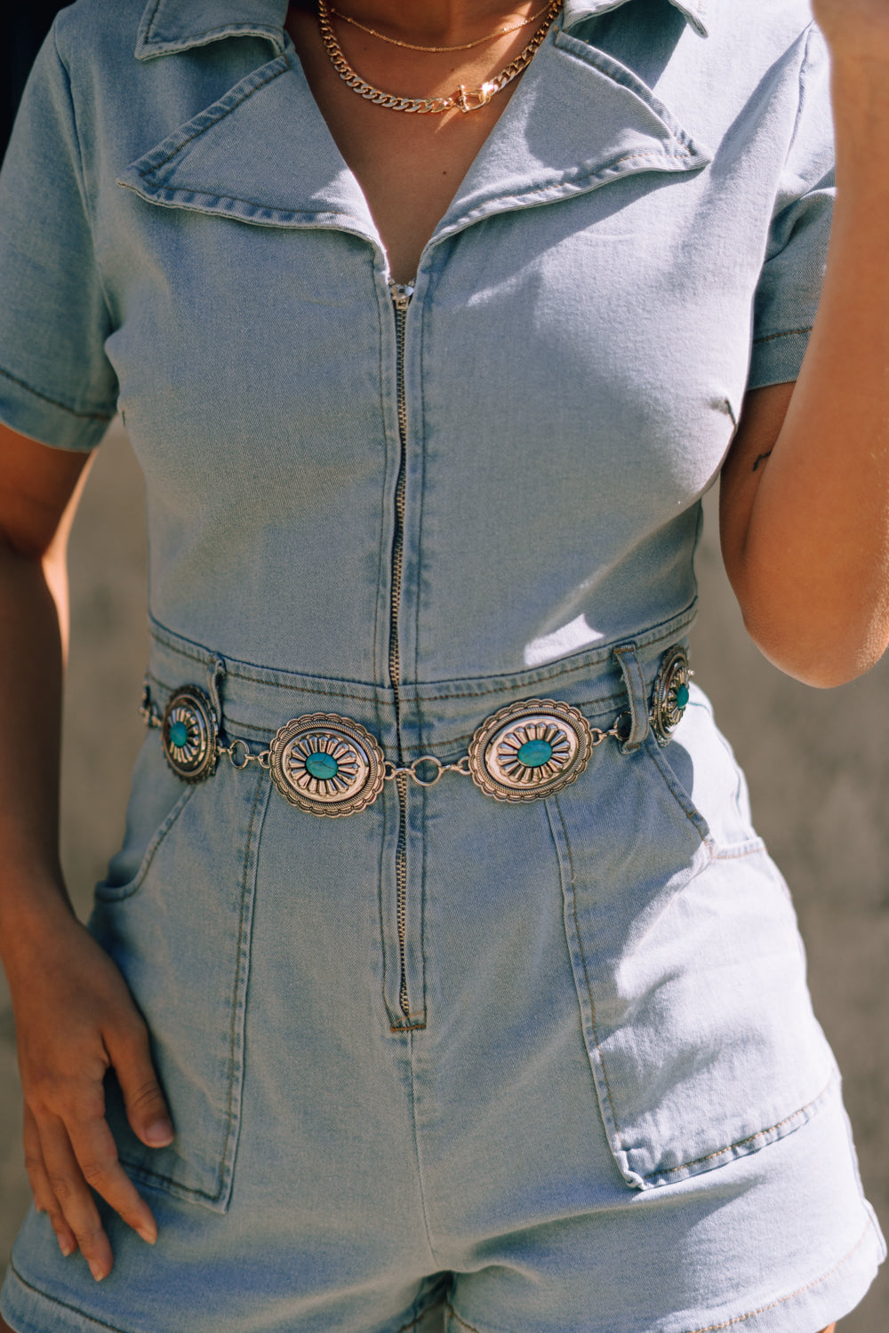 Close up front view of female model wearing the Hannah Silver & Turquoise Medallion Chain Belt which features Silver Metal Medallions, Turquoise Stone Details, Chain Links and Adjustable Clasp Closure