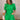 front view of female model wearing the Lea Green Puff Sleeve Mini Dress that has kelly green fabric, a smocked upper with high neck, short puff sleeves, and mini length. Model is holding coffee and has purse on shoulder.