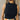 Close up of model wearing the Emerie Black Tank. This is a black sleeveless tank with a high neckline.