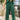 Close up of model wearing the Naya Forest Green Pants. These are green pants with a wide leg look.