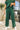 Close up of model wearing the Naya Forest Green Pants. These are green pants with a wide leg look.