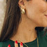 Close up of female model wearing the Grace Gold Chunk Hoops. These are gold chunk hoops, with a contemporary twist.