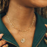 Close up of model wearing the Elena Gold Layered Pendant Necklace. This is a gold layered necklace, chain link, gold pendant. 