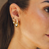 Close up of model wearing the Layla Gold Teardrop Studs. These are gold teardrop stud earrings.