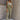 Full body view of model wearing the Khloe Olive Denim Jumpsuit. This is a olive green denim jumpsuit, tied straps, sleeveless. 