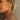 Close up of female model wearing the Emilia Gold Hoops. These are gold hoops with little studs on them.