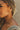 Close up of female model wearing the Emilia Gold Hoops. These are gold hoops with little studs on them.