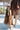 Faye Brown Leather Shoulder Purse- front view in model's hand