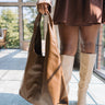 Faye Brown Leather Shoulder Purse- front view in model's hand