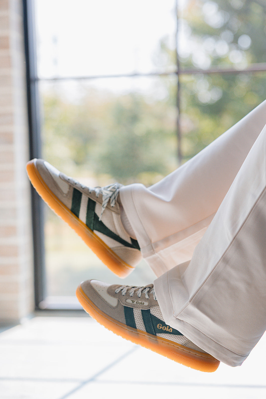 Gola Hawk Trainer Off White & Evergreen Sneaker - side view on model