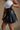 Nylah Black Faux Leather Pleated Skirt- close up side view
