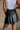 Nylah Black Faux Leather Pleated Skirt- back view