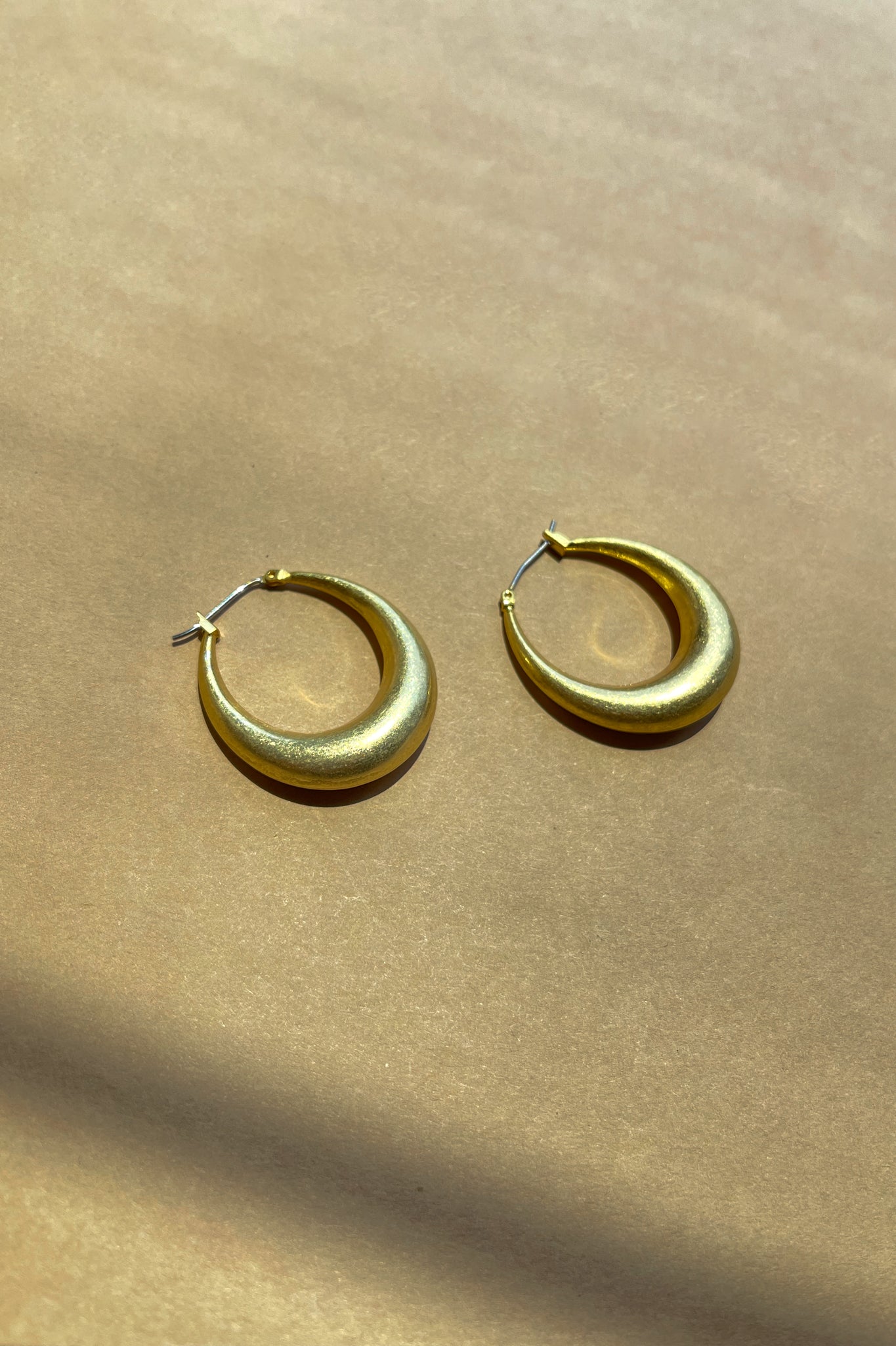 Ella Brushed Gold Closed Hoop Earring- close up front view