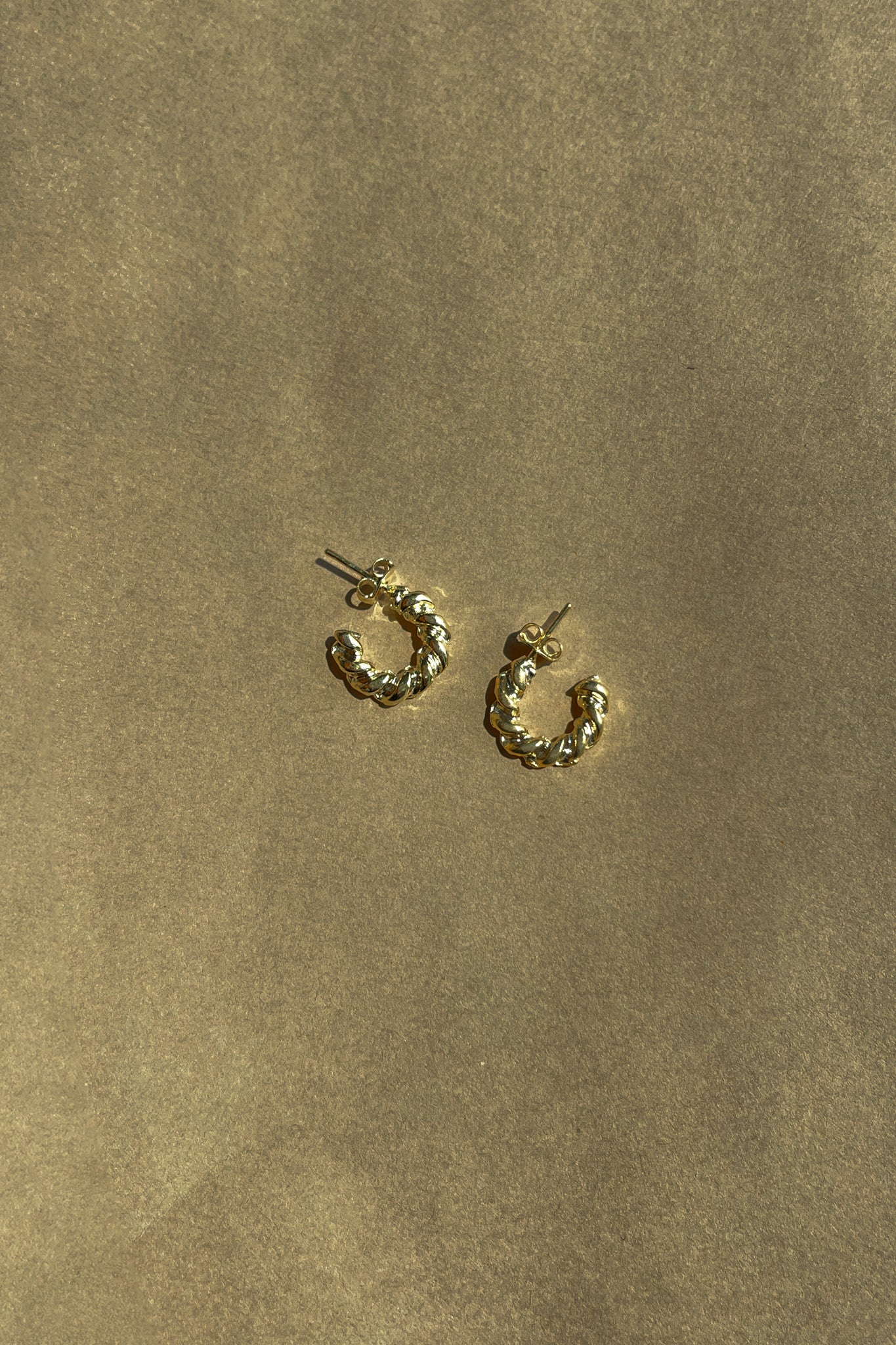 Aria Gold Mini Twisted Hoop Earring- close up front view