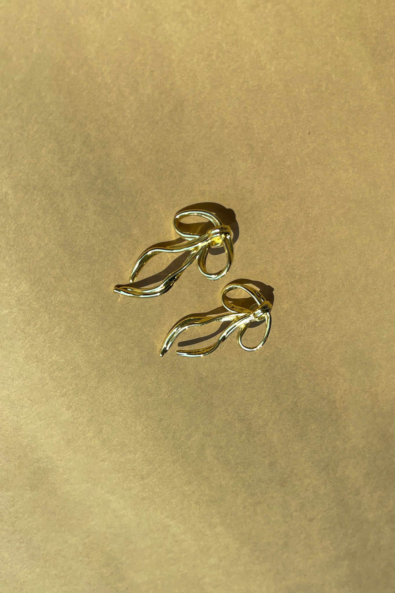 Natalia Gold Hammered Bow Earring- top view