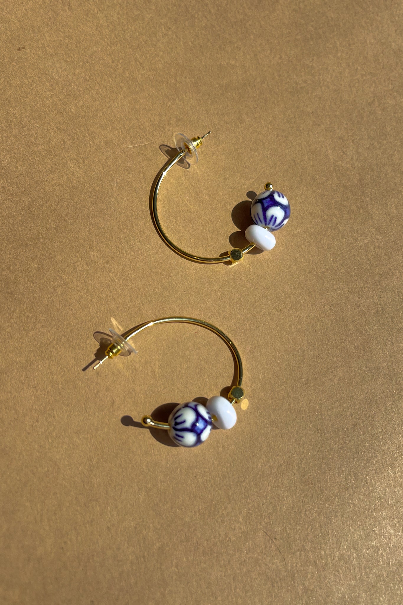 Ellie White & Blue Floral Hoop Earring- flat lay view
