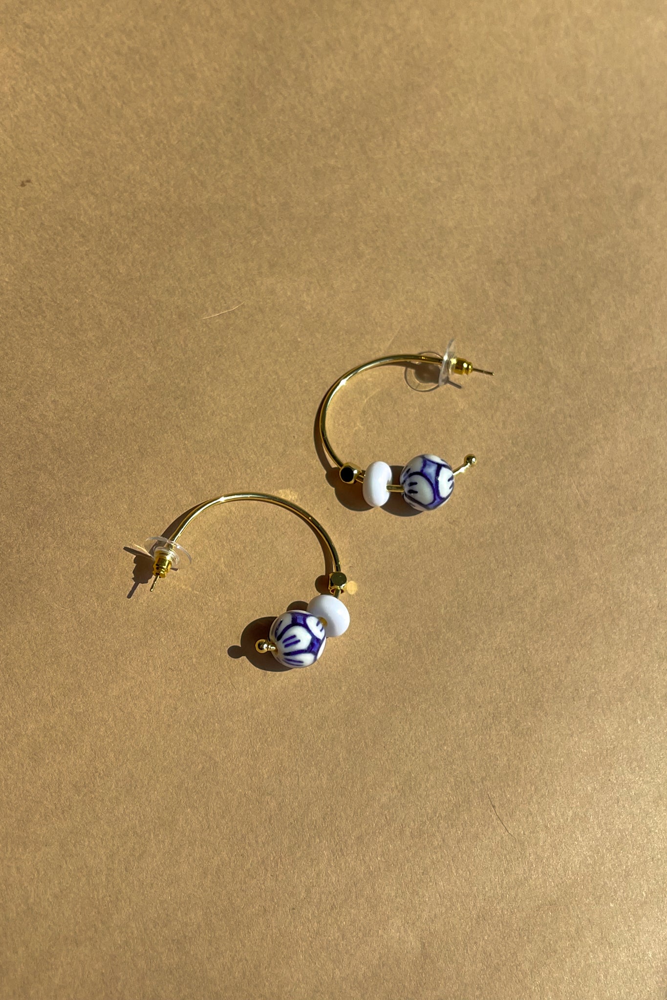 Ellie White & Blue Floral Hoop Earring- front flat lay view