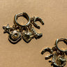 Hayden Gold Charm Huggie Earrings - close up flat lay