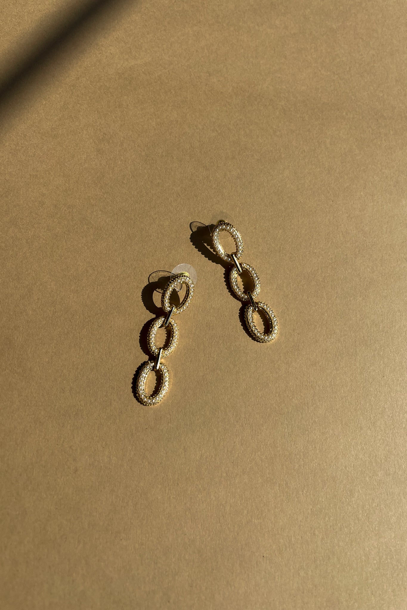 Melinda Gold & Pearl Chain Earrings - top flat lay view