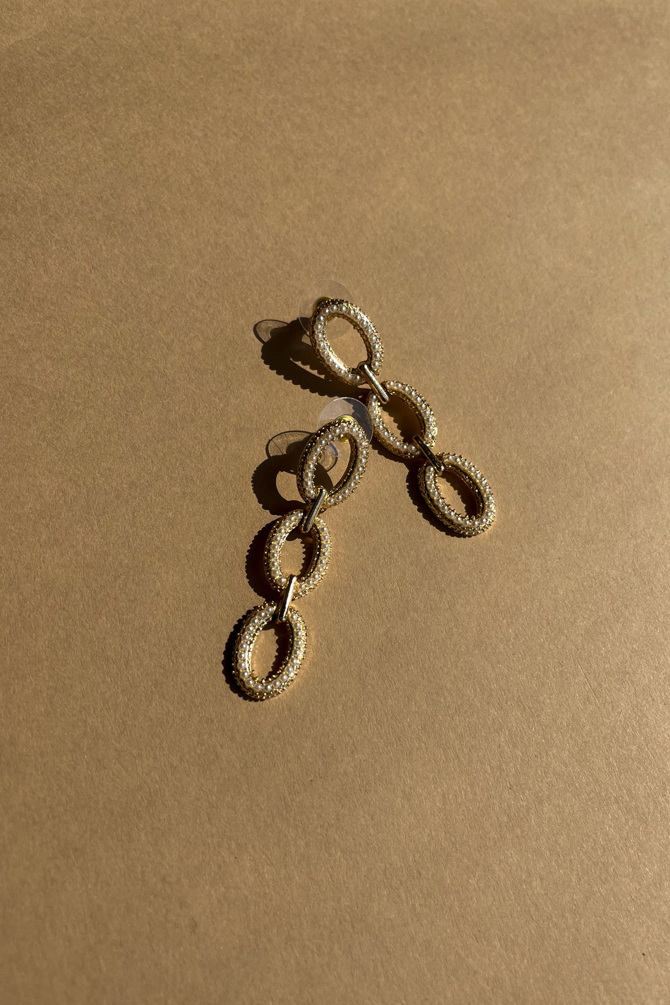 Melinda Gold & Pearl Chain Earrings - close top flat lay view